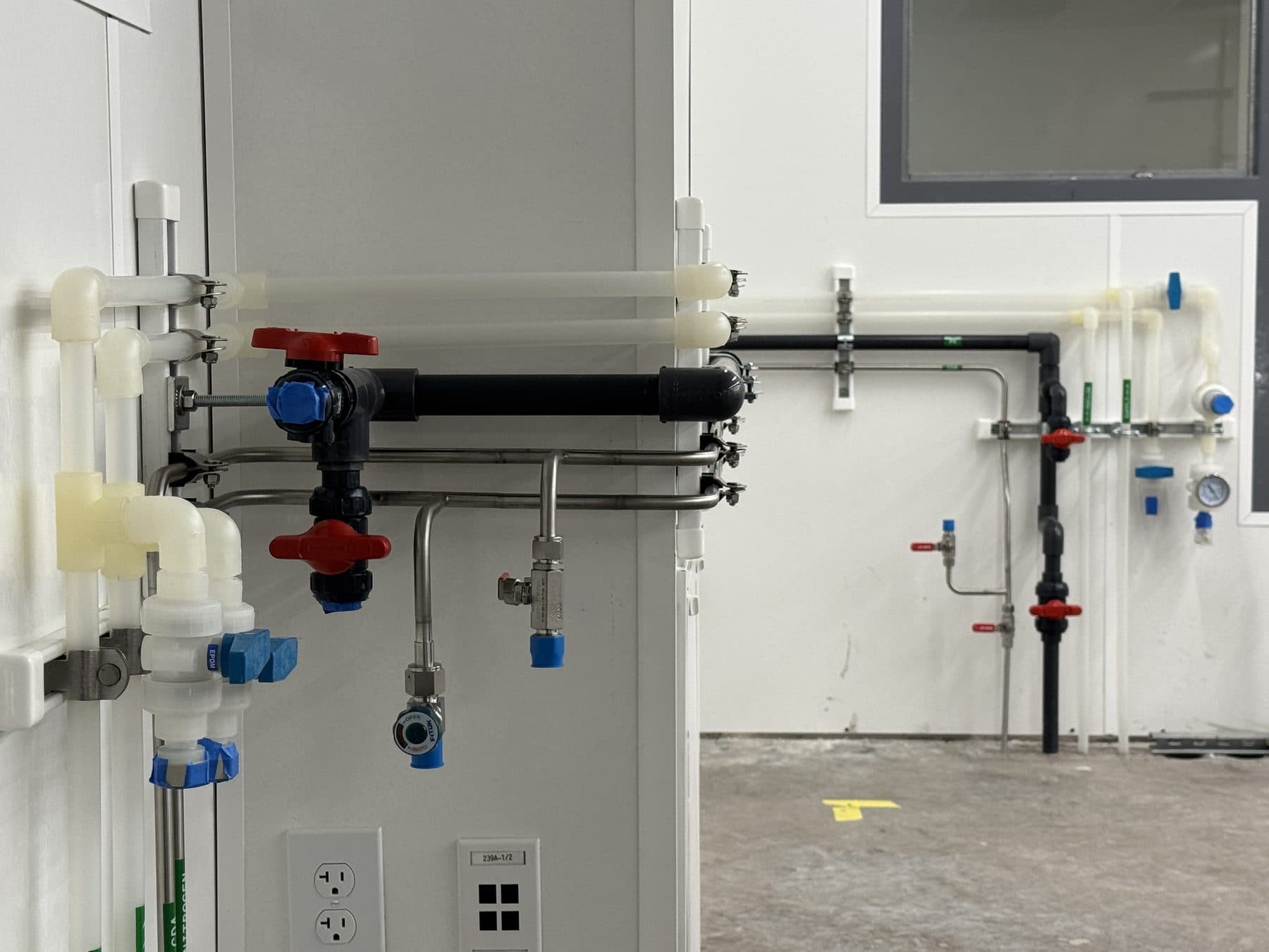 New laboratory buildout combining orbital-welded stainless steel tubing, Schedule 80 PVC and welded polypropylene lines for high-purity DI water